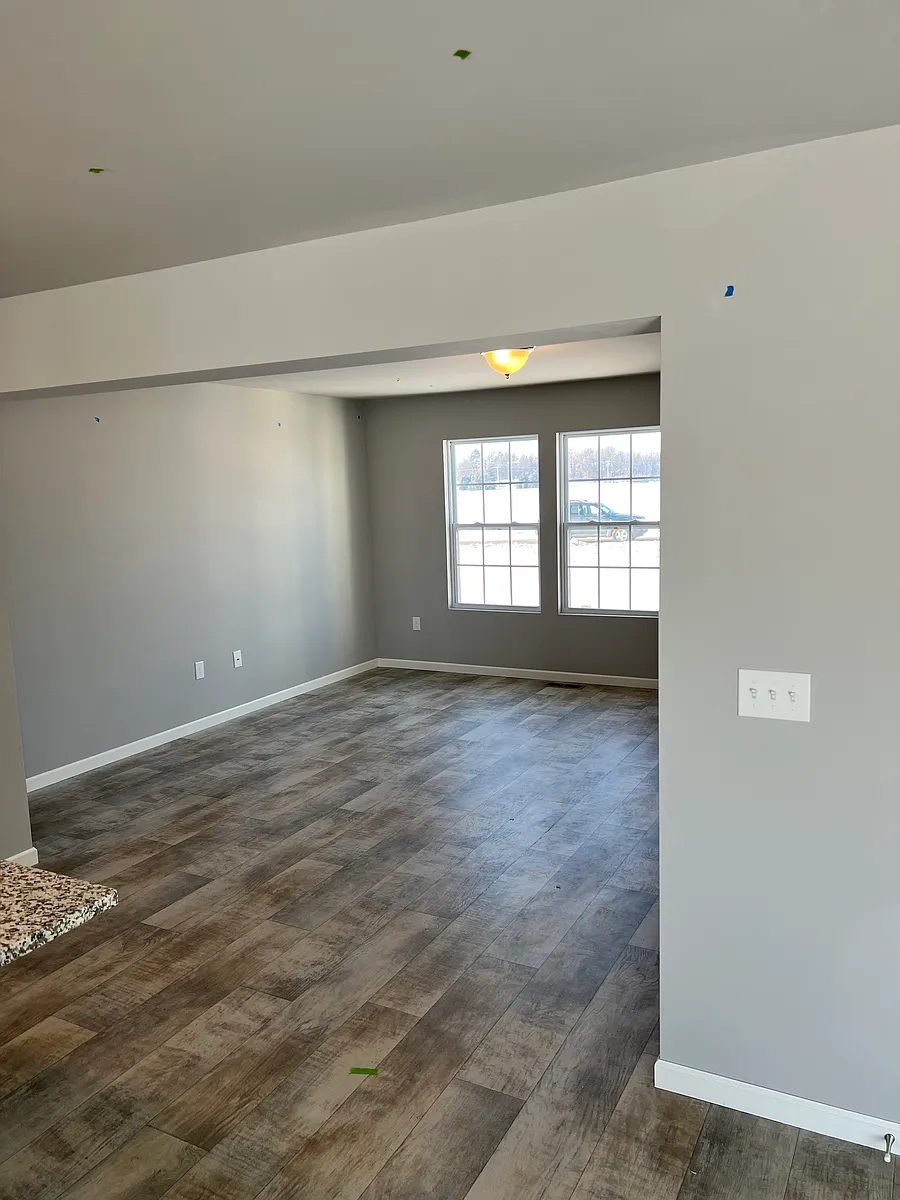 Looking at the family room from the kitchen/dining area. - 17211 Country Ln