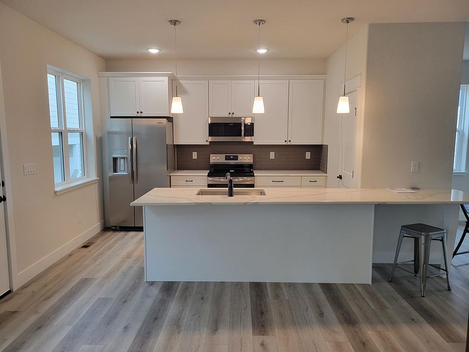 Kitchen, taken from dining room. Pantry behind door on right.