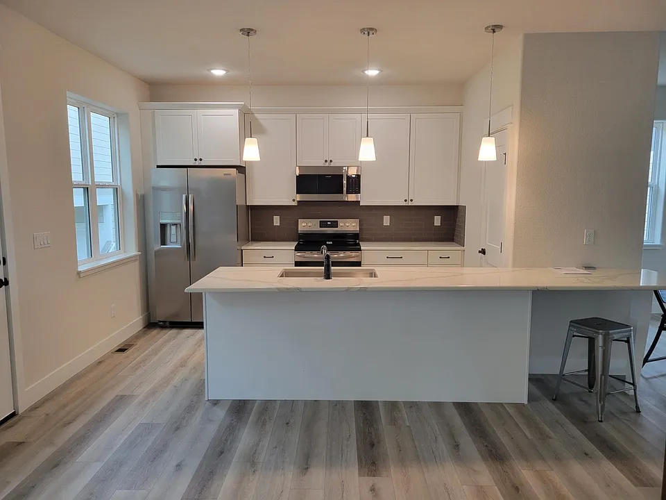 Kitchen, taken from dining room. Pantry behind door on right.
