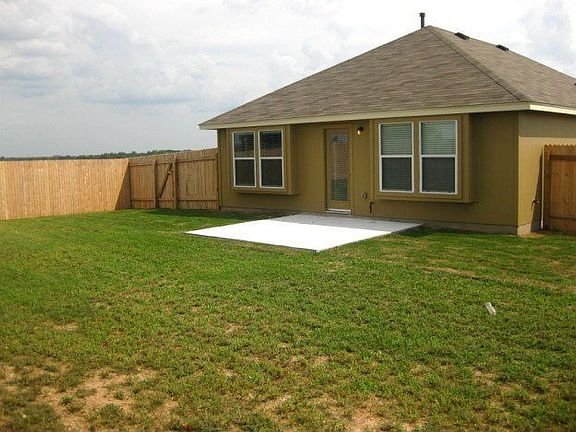 Fenced yard with patio for outdoor enjoyment