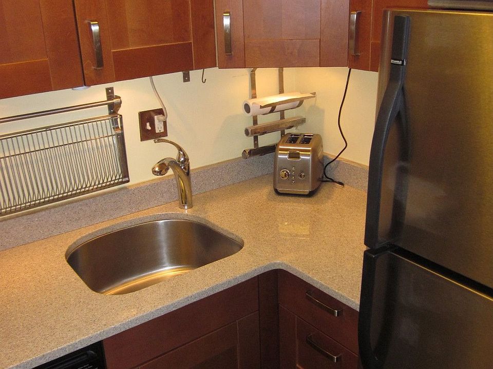 Kitchen has great countertops and stainless steel appliances.