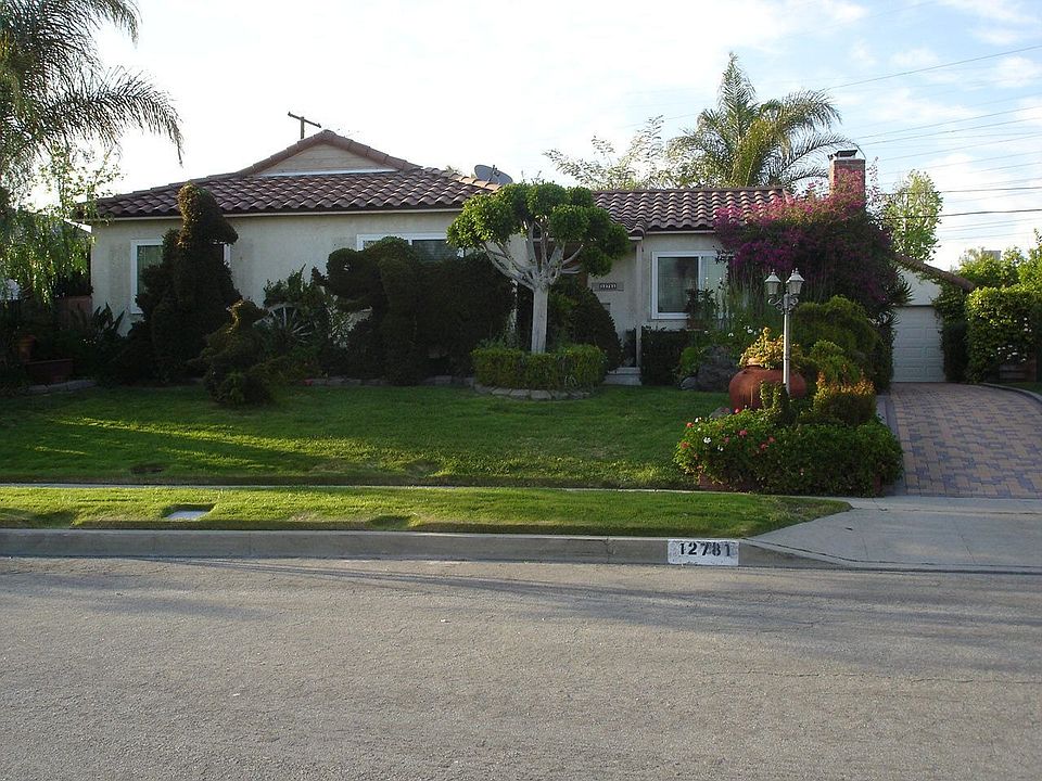 FRONT OF HOUSE AND NEWLY PAVED DRIVEWAY