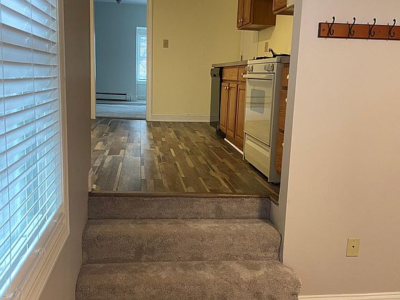 Steps from the Recreation Room to the Kitchen.
