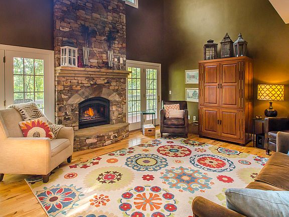 French doors flank fireplace