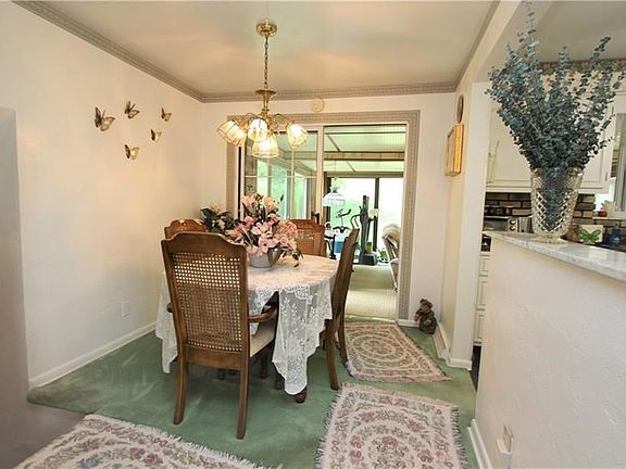 Gorgeous Formal 10x9 Dining Room opens Nicely into Kitchen w/ Marble Top Divider and leads into 1st Floor Family Room thru Slidi