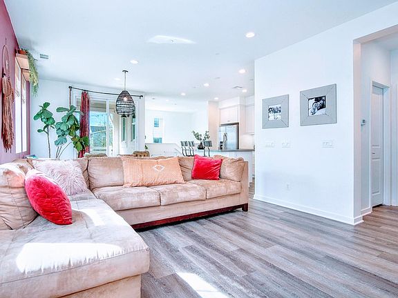 Spacious open floor plan layout with kitchen, dining room, living room, and powder room