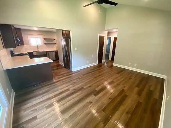 Living Room and Kitchen Area. Vaulted ceilings.
