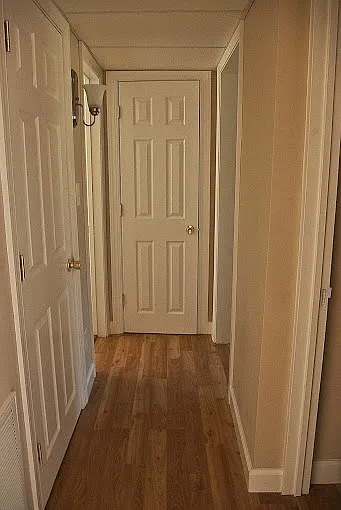 Hallway to bedrooms and bathroom.