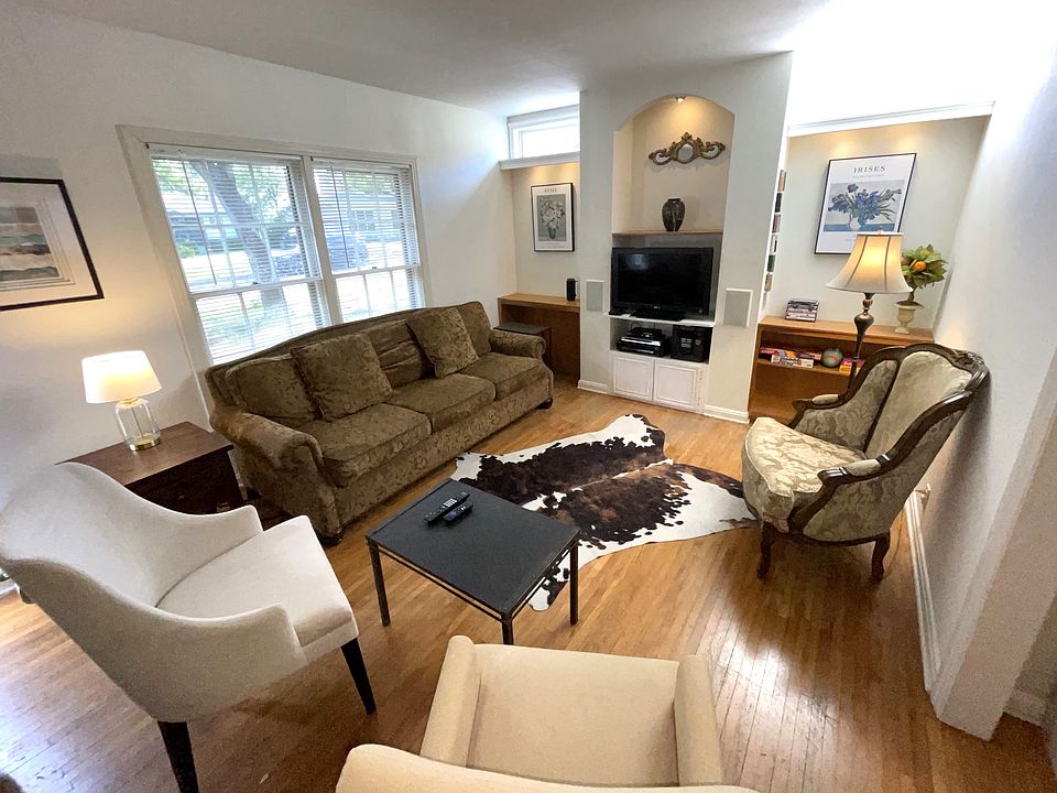 Stylish Living Room Features Wood Floors, LED TV with Roku For Streaming, Built-In Bookshelves and LED Lighting, Bluetooth Speaker. Sofa is a Queen Sleeper With Gel Memory Foam Mattress
