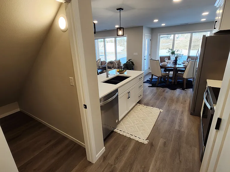 Large storage space off the hallway from the garage entrance into kitchen. (Pictures are of another unit with similar finishes and features.)