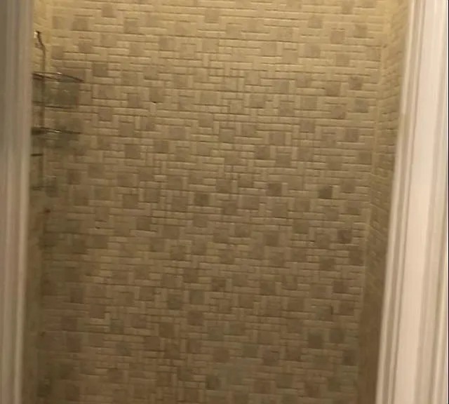 Tiled shower with high ceilings