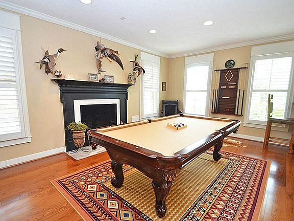 THE LIVING ROOM IS SPACIOUS!IT FEATURES AN ELEGANT FIREPLACE,WOOD FLOORING &PLANTATION SHUTTERS!