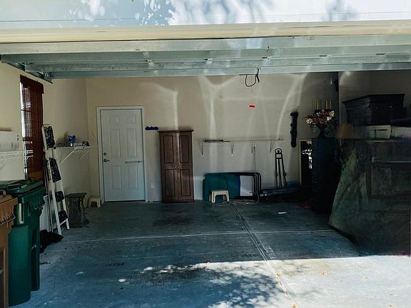 2 Car Garage with one window. The door has a hydraulic closer with a stopper.