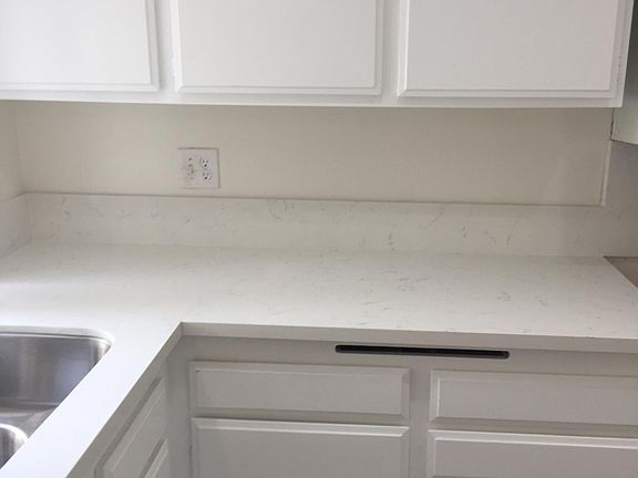 New quartz counter tops in kitchen and bathrooms