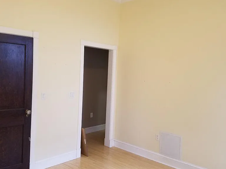 Living room with ceiling fan and two nice big windows.