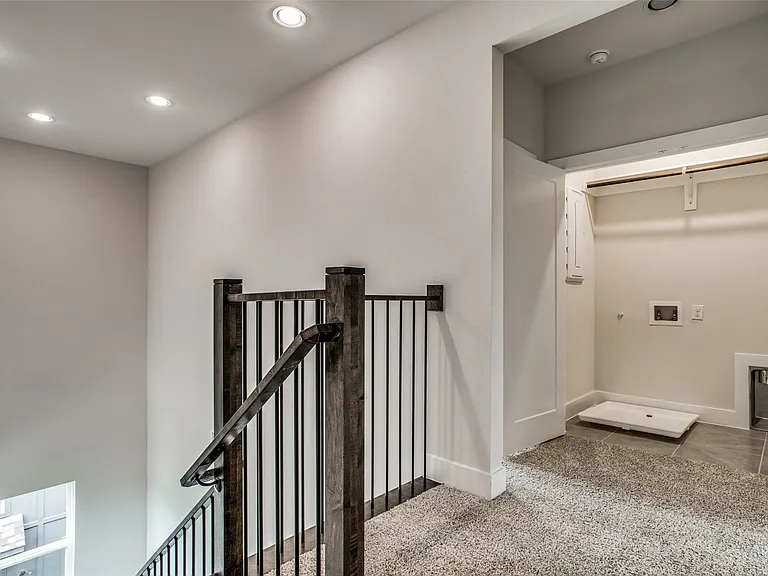 The laundry area is at the top of the stairs on the 3rd floor.