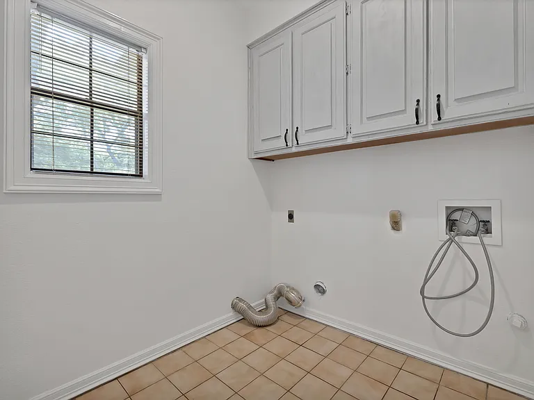 Laundry Room with cabinets.