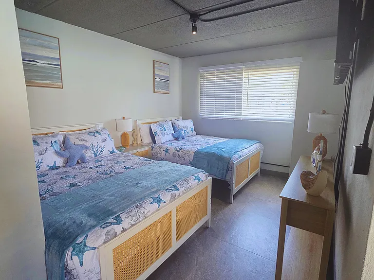 Relax in comfort with queen beds, a full kitchen, and a private bath.