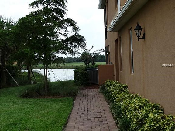 Private brick paver walkway to the side entry door.