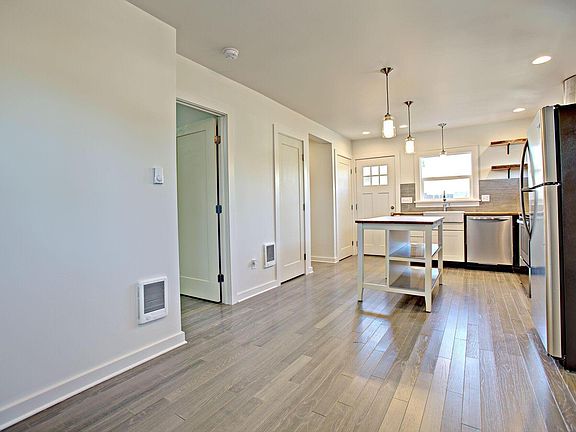Open concept. View of kitchen from living area with pantry