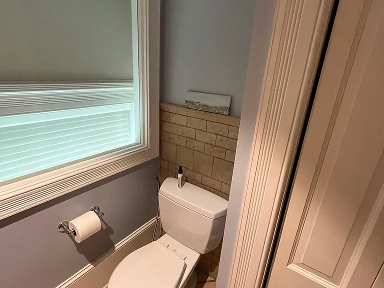 Toilet with inset window to first floor enabling natural light and the loft bathroom.
