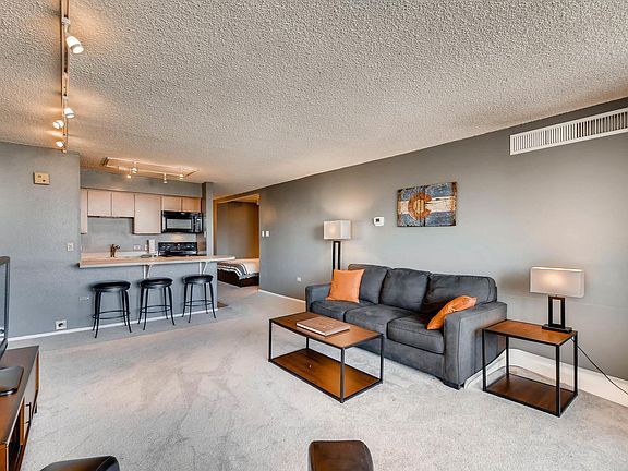 Living area looking towards, kitchen and front door