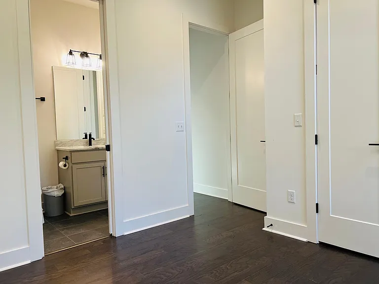 Downstairs bedroom/office space with large closet and full bath