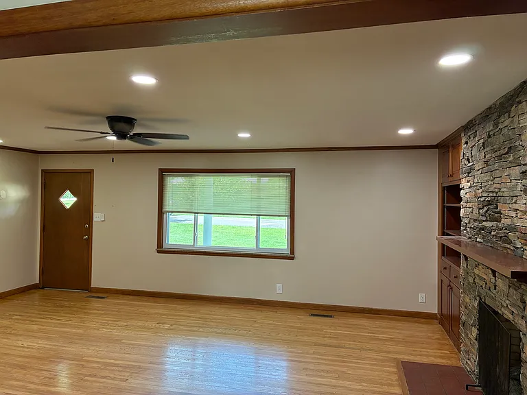 Main room is 20x25, wood tones throughout the house.