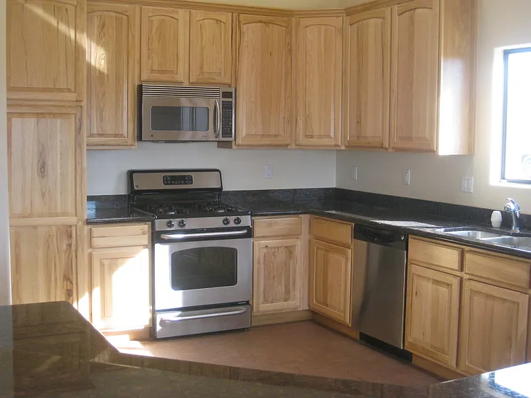 Kitchen with stainless steel appliances and eat up island/ba