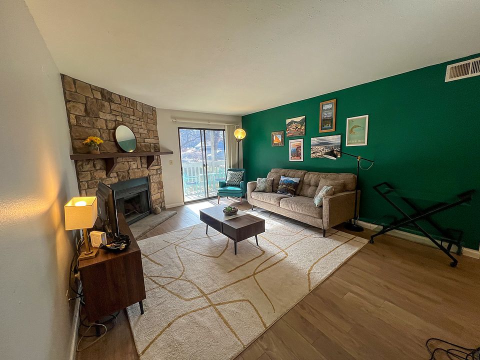 Living room with wood-burning fireplace