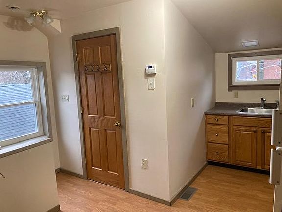 This shows the bathroom door in relation to the kitchen.
