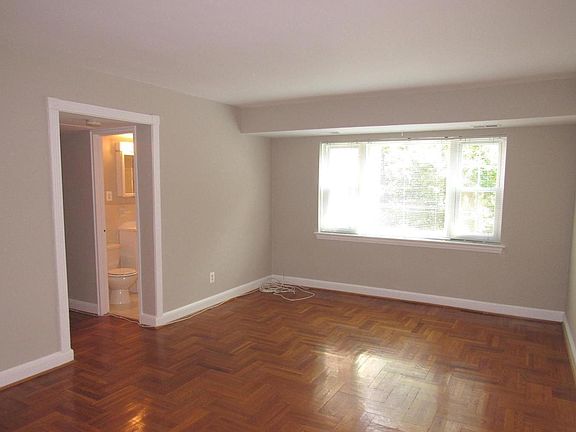 Living room with hallway to the bedrooms and bathroom