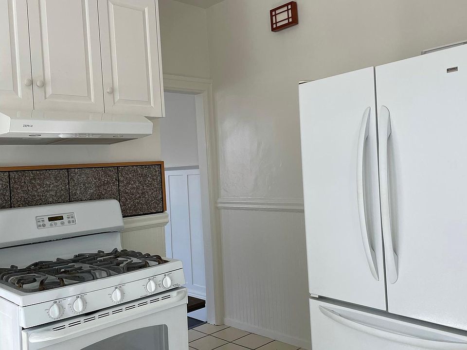 Kitchen with gas stove, refrigerator