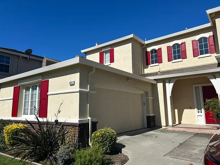 Front of the house, facing east, freshly painted exteriors