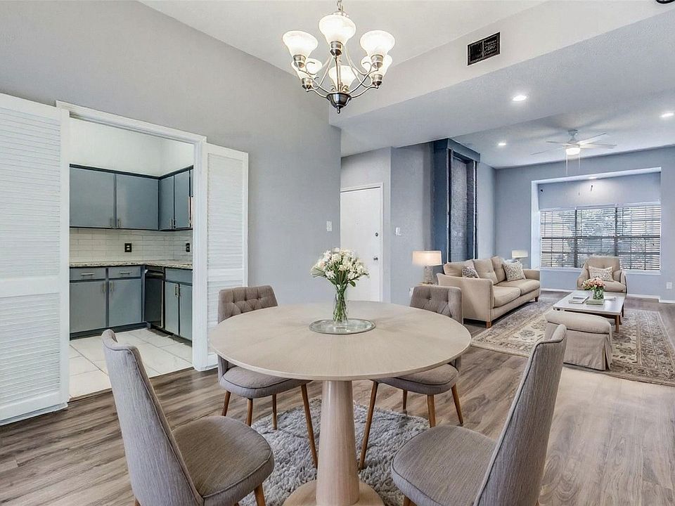 Dining room & kitchen shown with virtual AI staging.