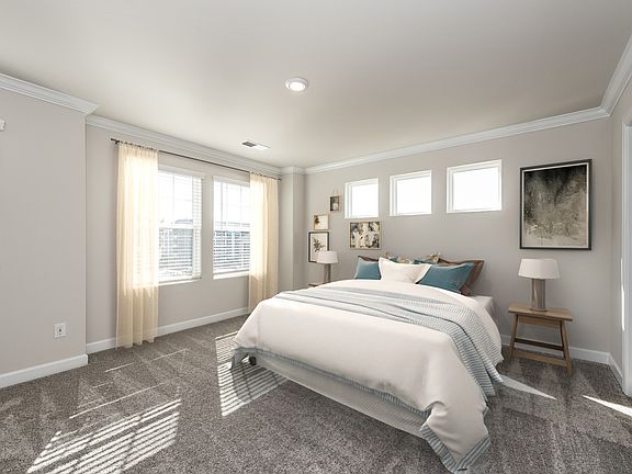 Relax and unwind in the secluded primary suite after a long day.