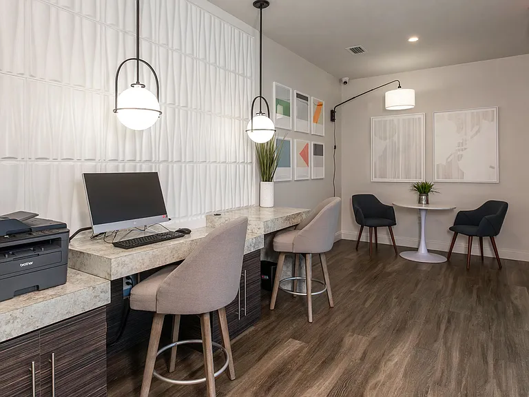Stay productive at Grand Oaks Apartments with our stylish resident business center, complete with computer stations, high-speed internet, printer access, and comfortable seating.