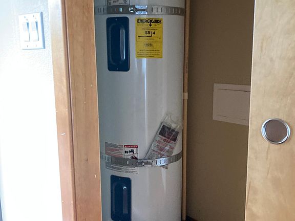 Water heater front coat closet