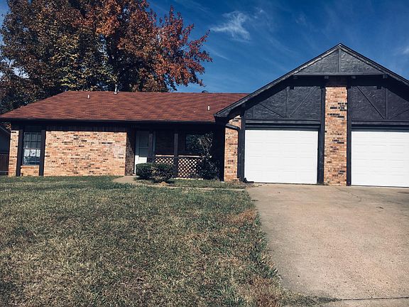 A side front entrance and garage.