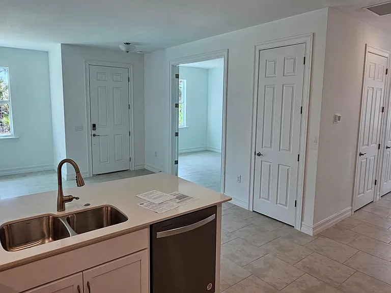 Kitchen view looking into Bonus Room and Dining area