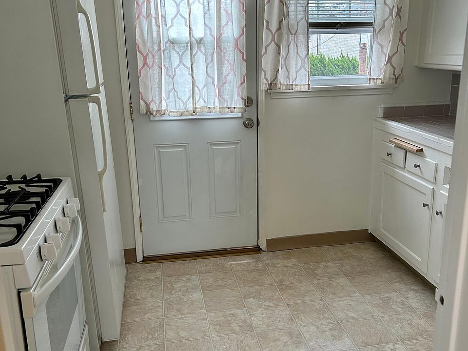 Kitchen w/large frig & stove-oven