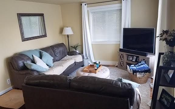 same living room -different furniture setup