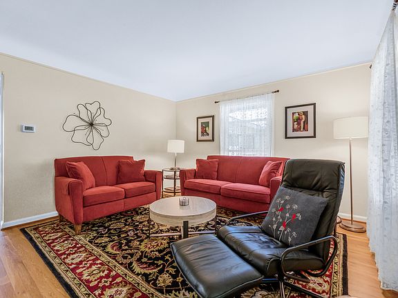 A warm and welcoming living room greets you as you enter the home.