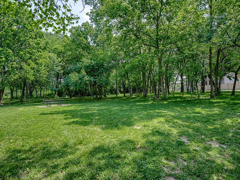 Pleasant Lea Park also features a large paved walking path through the woods around the large open picnic area