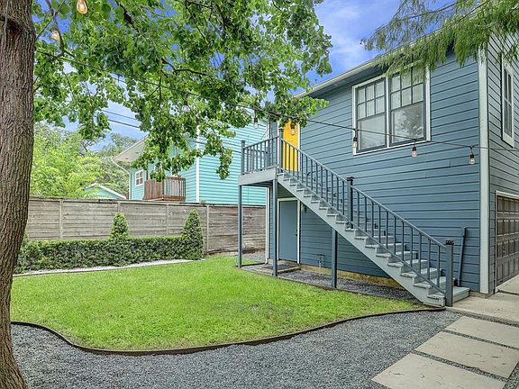 GARAGE APARTMENT: The remodeled contemporary garage apartment features a spacious open floor plan; ready as a comfortable guest quarters or a revenue-generating rental.