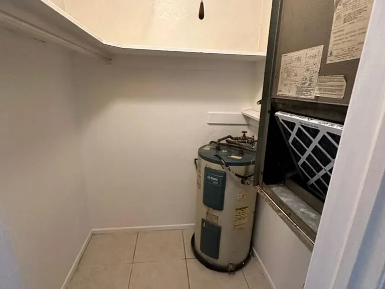 walk in closet with central air/heat and water heater