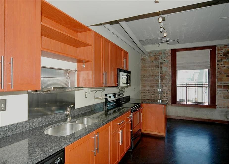 Entrance view of loft, updated kitchen, stained concrete flooring.