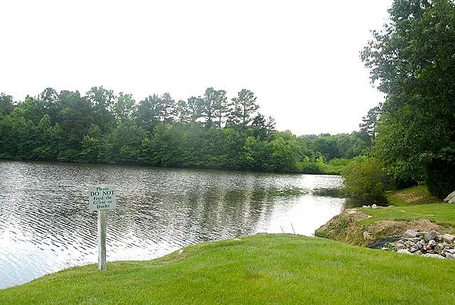 Village Lakes has 4 miniature lakes for kayaking, boating, and fishing. View of lake behind home.