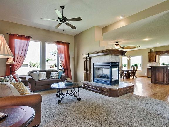 Open floorpan with 2 way fireplace and 10 ft ceilings.