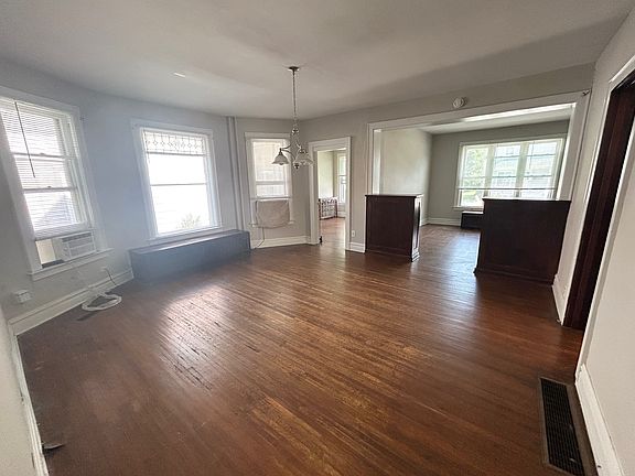 Dining room, living room with built-in cabinets between